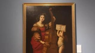 Lienzo de Santa Cecilia tocando la viola con un ángel que sostiene una partitura musical, Obra Destacada de la Sala 6.