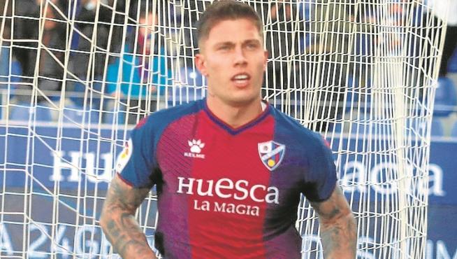 Cristo González celebra un gol en su etapa en la SD Huesca.