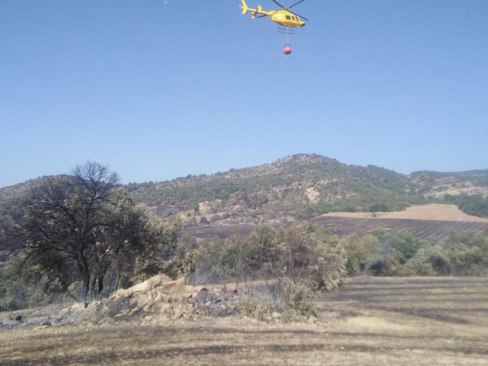 Trabajos en el lugar del incendio en Güel, este sábado.