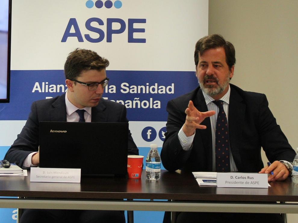 El secretario general, Luis Mendicuti, y el presidente de ASPE, Carlos Rus.