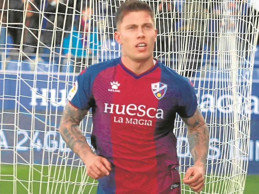 Cristo González celebra un gol en su etapa en la SD Huesca.